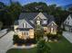 Beautiful stone and siding home with manicured lawn and landscape lighting at twilight at 1325 Mackinaw Dr, Wake Forest, NC 27587