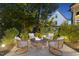 Cozy backyard fire pit area with stone surround and comfortable seating, great for outdoor entertaining at 1325 Mackinaw Dr, Wake Forest, NC 27587