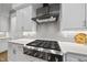 Modern kitchen features stainless steel gas range and stylish subway tile backsplash at 1325 Mackinaw Dr, Wake Forest, NC 27587