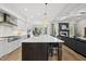 Spacious kitchen showcasing large island, open layout, and seamless flow into the living area at 1325 Mackinaw Dr, Wake Forest, NC 27587