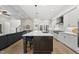 Spacious kitchen boasts island seating and seamless flow into the living area at 1325 Mackinaw Dr, Wake Forest, NC 27587