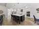 Open kitchen with large island, stainless appliances, and easy access to the pantry at 1325 Mackinaw Dr, Wake Forest, NC 27587