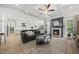 Open concept living room with fireplace and coffered ceiling adjacent to kitchen at 1325 Mackinaw Dr, Wake Forest, NC 27587