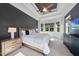 Spacious main bedroom with a tray ceiling, fan, many windows, and a peaceful view at 1325 Mackinaw Dr, Wake Forest, NC 27587