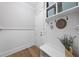 Neat mudroom with white wainscoting, a storage bench, coat hooks, and decoratively organized storage baskets at 1325 Mackinaw Dr, Wake Forest, NC 27587