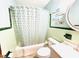 Cozy bathroom with a shower and tub combination and unique decorative tiling at 1337 Maple St, Rocky Mount, NC 27803