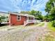 Charming single-story brick home with a covered porch and well-maintained yard at 1337 Maple St, Rocky Mount, NC 27803