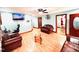Inviting living room with laminate floors, ceiling fan, and comfortable leather furnishings at 1337 Maple St, Rocky Mount, NC 27803