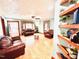Spacious living room featuring laminate floors, a ceiling fan, and a cozy seating arrangement at 1337 Maple St, Rocky Mount, NC 27803