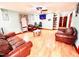 Inviting living room with laminate floors, ceiling fan, and comfortable leather furnishings at 1337 Maple St, Rocky Mount, NC 27803