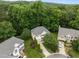 Aerial view of the home showcasing the landscaping, trees, and surrounding neighborhood at 15 Smoketree Ct, Durham, NC 27712