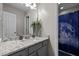 Bathroom featuring sleek vanity with granite countertop and decorative vases adding a touch of sophistication at 15 Smoketree Ct, Durham, NC 27712