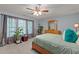 Cozy bedroom features ample natural light from the large windows, creating a tranquil and inviting atmosphere at 15 Smoketree Ct, Durham, NC 27712