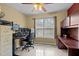 Bedroom with carpet, ceiling fan, and large windows offer a comfortable space for relaxation and work at 15 Smoketree Ct, Durham, NC 27712