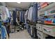 Walk-in closet with custom shelving and ample storage provides organization for clothing and accessories at 15 Smoketree Ct, Durham, NC 27712