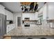Modern kitchen with granite countertops, stainless steel appliances, and stylish cabinetry for a sleek design at 15 Smoketree Ct, Durham, NC 27712