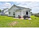 Backyard with grassy area and patio, ideal for outdoor entertainment and relaxation at 1516 Greys Mill Rd, Rocky Mount, NC 27804