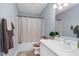 Full bathroom featuring tub and shower combo with complementary colored towels and decor at 1516 Greys Mill Rd, Rocky Mount, NC 27804