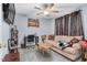 Comfortable bedroom with a ceiling fan, desk, and neutral-toned walls at 1516 Greys Mill Rd, Rocky Mount, NC 27804