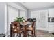 Cozy breakfast nook with bright windows and a charming wooden dining table at 1516 Greys Mill Rd, Rocky Mount, NC 27804