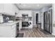 Modern kitchen featuring white cabinets, stone countertops, and stainless steel appliances at 1516 Greys Mill Rd, Rocky Mount, NC 27804