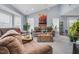 Bright living room featuring plush sofas, a vaulted ceiling, and neutral gray walls at 1516 Greys Mill Rd, Rocky Mount, NC 27804