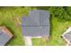 Birds eye view of house, gray roof, green lawn and driveway in a neighborhood setting at 1713 Elder Ct, Burlington, NC 27215