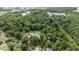Wide aerial shot displaying the neighborhood, highlighting the home's location and surrounding nature at 1713 Elder Ct, Burlington, NC 27215