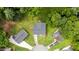 An aerial perspective of the home, showcasing its well-maintained roof and surrounding greenery at 1713 Elder Ct, Burlington, NC 27215