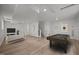 Finished basement with a pool table, sofa, TV, and light vinyl flooring at 1713 Elder Ct, Burlington, NC 27215