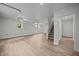 Large basement featuring light vinyl flooring, stairs, and windows at 1713 Elder Ct, Burlington, NC 27215