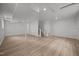 Spacious finished basement featuring laminate flooring, recessed lighting, and fresh white walls at 1713 Elder Ct, Burlington, NC 27215
