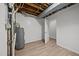 Utility area in basement with water heater and open ceiling at 1713 Elder Ct, Burlington, NC 27215