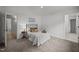 Cozy bedroom featuring a wrought iron bed frame, soft textures, and access to ensuite bathrooms at 1713 Elder Ct, Burlington, NC 27215