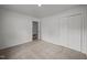 Spacious bedroom with plush carpet, closet, and doorway at 1713 Elder Ct, Burlington, NC 27215