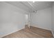 Neutrally painted bedroom with wood floors and closet at 1713 Elder Ct, Burlington, NC 27215