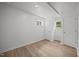 Clean bedroom featuring two bright windows and wood floors at 1713 Elder Ct, Burlington, NC 27215