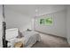 Inviting bedroom bathed in natural light, featuring a comfortable bed, and carpet flooring at 1713 Elder Ct, Burlington, NC 27215