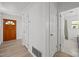 Hallway featuring hardwood flooring and access to bathroom and rooms at 1713 Elder Ct, Burlington, NC 27215