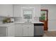 The kitchen's sink, dishwasher and ample countertop space are ready for food prep at 1713 Elder Ct, Burlington, NC 27215