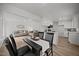 Open-concept design showcasing the living room and dining area with stylish furnishings and light-filled ambiance at 1713 Elder Ct, Burlington, NC 27215