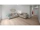 Bright living room featuring neutral-toned sofas, accent pillows, and modern decor elements at 1713 Elder Ct, Burlington, NC 27215