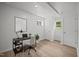 Bright office space with stylish desk, decor, and natural light from two windows at 1713 Elder Ct, Burlington, NC 27215