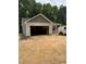 New construction shows a one-story home with an attached two car garage and neutral siding and trim at 185 Rollins Acres Ln, Lillington, NC 27546