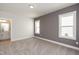 Spacious bedroom with ample lighting and neutral carpet at 1907 Plott Balsam Dr, Wendell, NC 27591