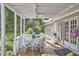 Charming covered porch featuring wicker furniture, with a view of the landscaped backyard at 1913 Fawndale Dr, Raleigh, NC 27612