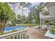 A spacious backyard with a refreshing pool, patio area, and lush landscaping creates an oasis at 1913 Fawndale Dr, Raleigh, NC 27612