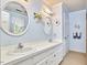 Stylish bathroom featuring double sinks, blue walls, and ample counter space at 1913 Fawndale Dr, Raleigh, NC 27612