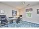 Well-lit bedroom with office space and a large window offering natural light at 1913 Fawndale Dr, Raleigh, NC 27612