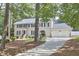 Charming two-story home featuring blue shutters, a two-car garage, and a well-manicured lawn at 1913 Fawndale Dr, Raleigh, NC 27612